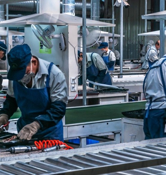 Workers assembling products on a factory production line