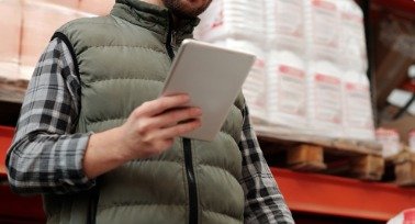 Warehouse worker checking stock on a tablet