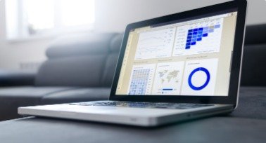 Laptop showing a business dashboard with charts